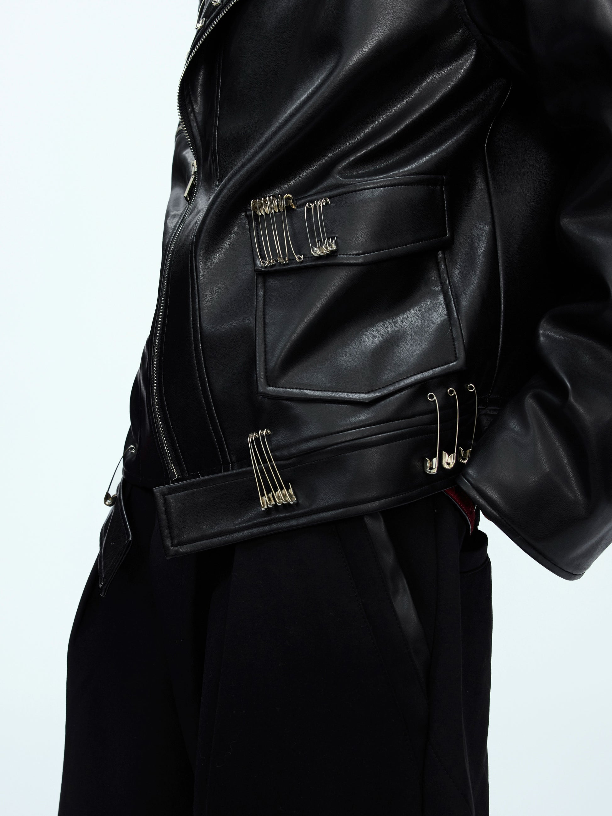 Black leather jacket with multiple paper clip designs