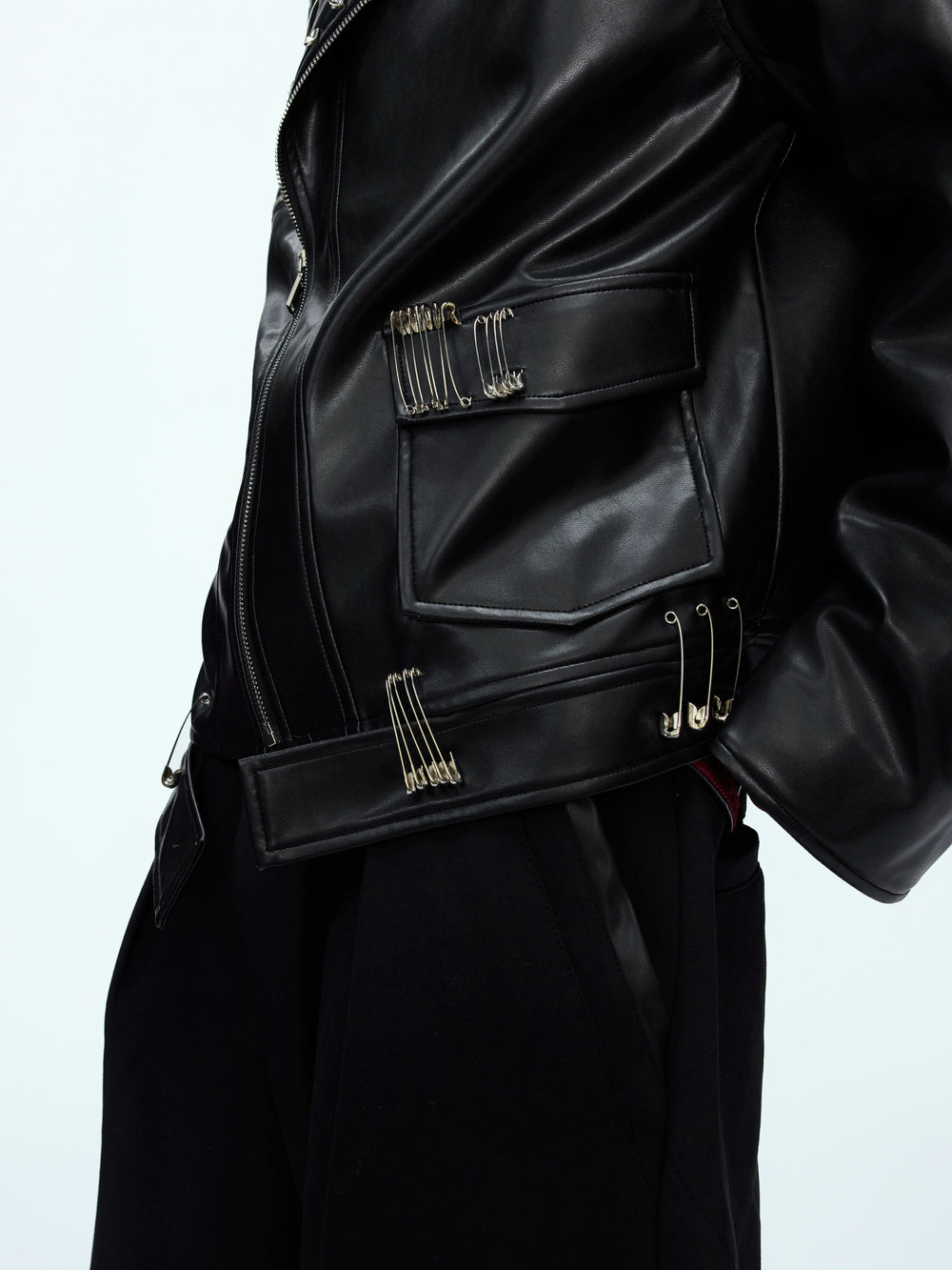 Black leather jacket with multiple paper clip designs
